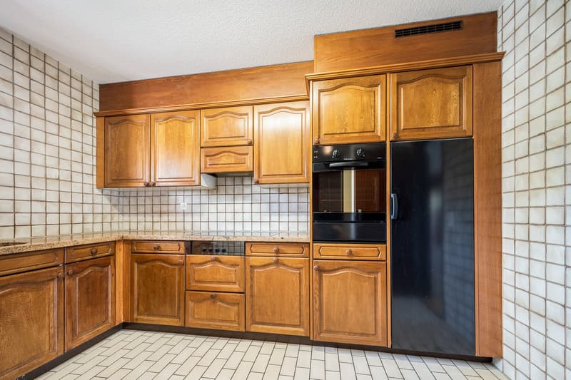 kitchen with wooden cabinets, tiled backsplash, oven, dishwasher, refrigerator