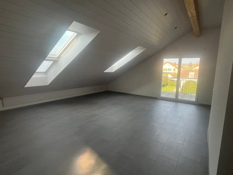 empty room, wooden ceiling, tiled floor, skylights, glass doors leading to balcony
