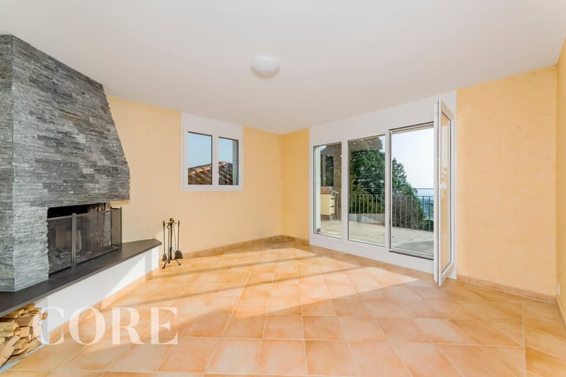 Fireplace, balcony, sliding glass doors, tiled floor, yellow walls, large windows