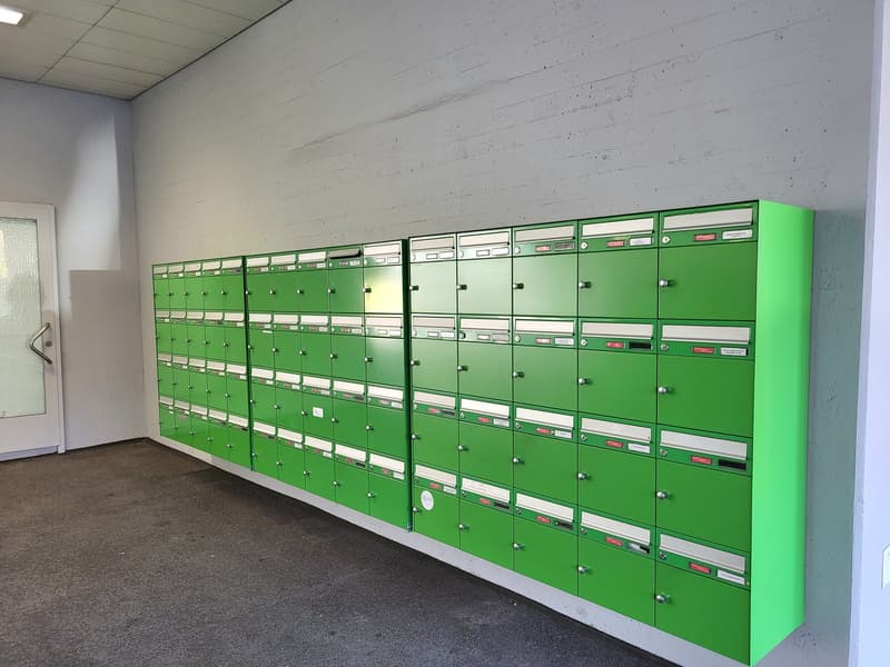 Wall mounted green mailboxes