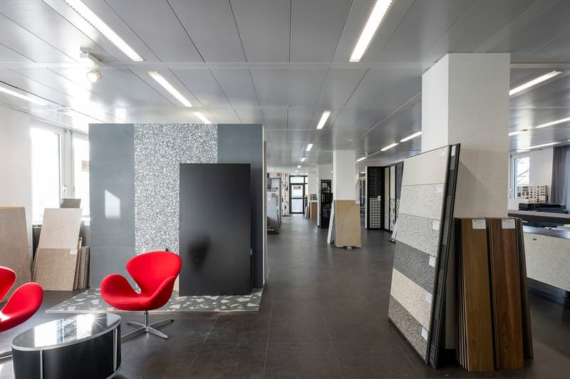modern office space with large room and display samples of tiles and wood flooring