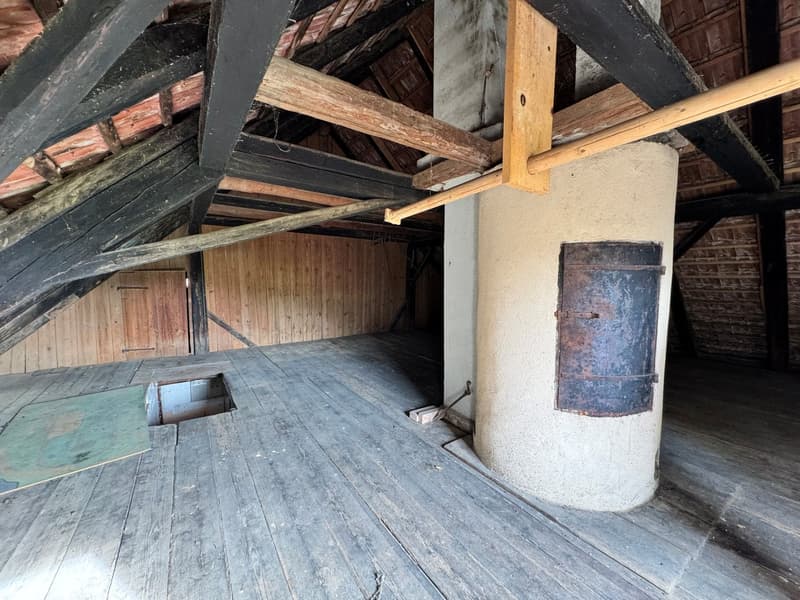 wooden floor, wooden walls, exposed wooden beams, fireplace