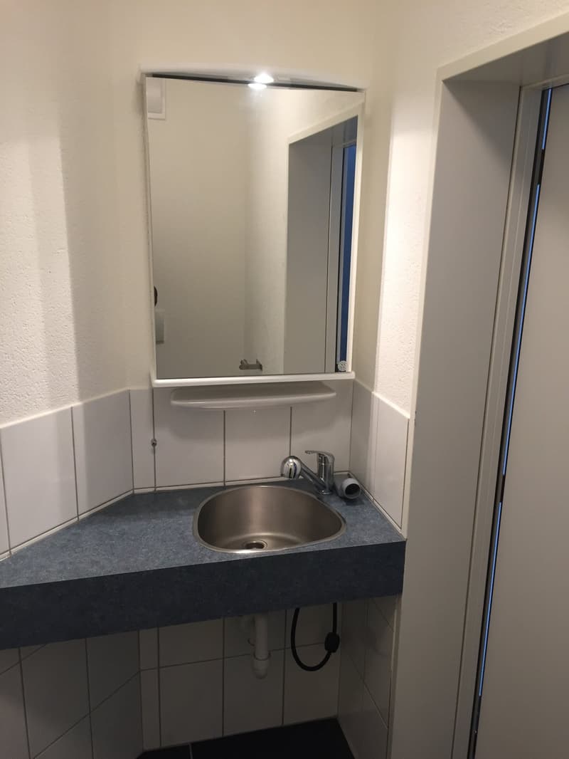 white walls, sink, faucet, mirror, white tiles