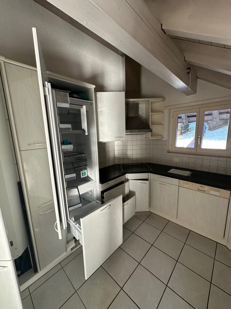 tiled floor, tiled wall, gas stove, oven, dishwasher, refrigerator, kitchen cabinets, extractor hood