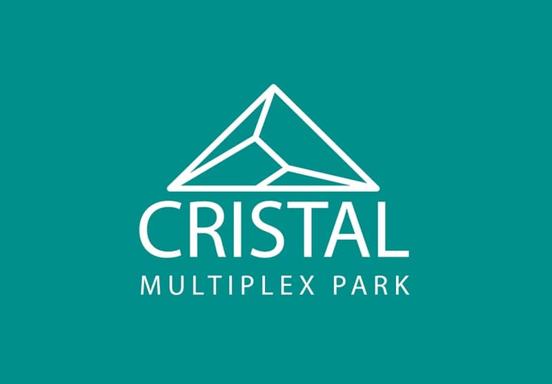 Logo of Cristal Multiplex Park with a mountain design in white