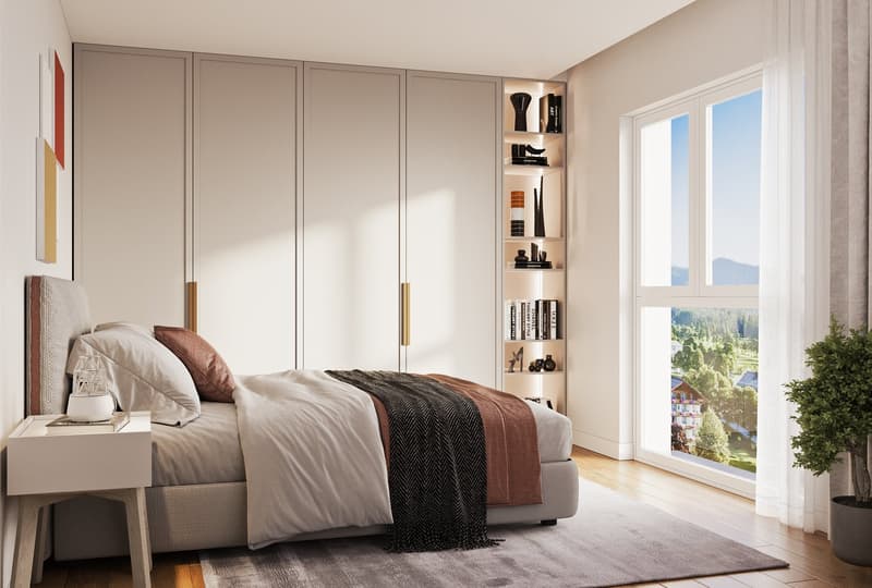 A modern bedroom with built-in wardrobes, a bed, bedside tables, a window with a view, and a small potted plant.