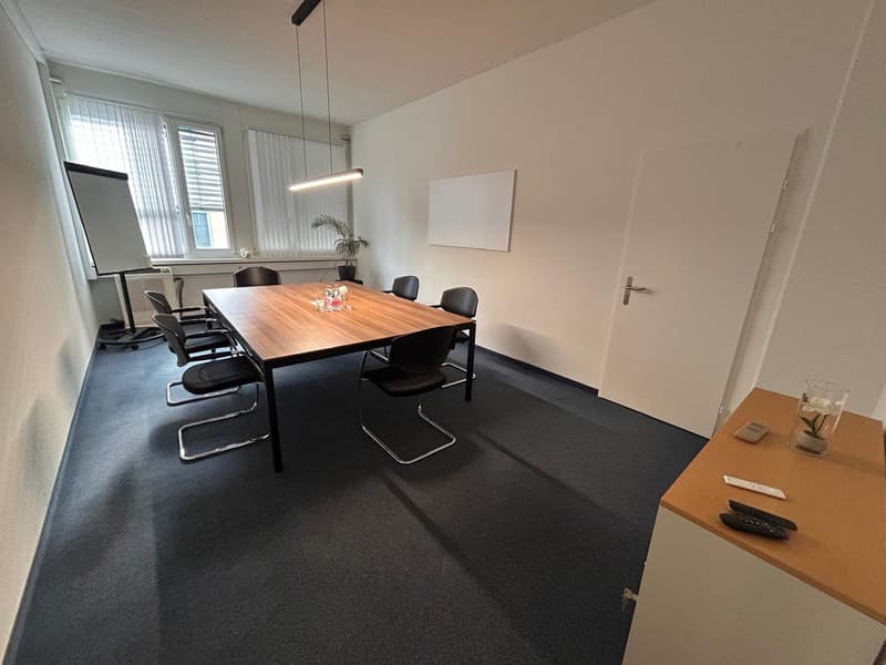 empty meeting room, desk, chairs, whiteboard, windows, door, lamp