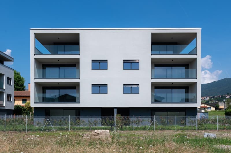 4 story building, glass walls, terraces, modern design, fenced property