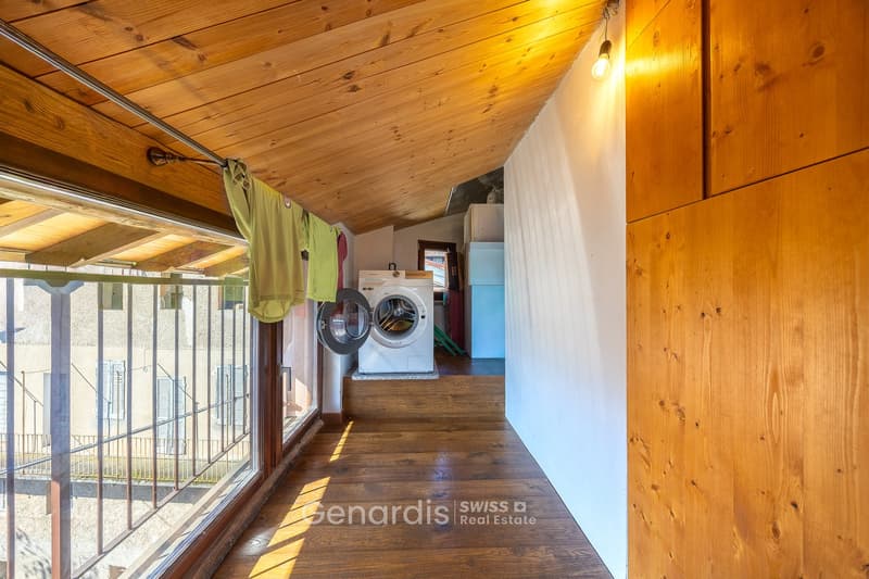 wooden ceiling, wooden floor, washing machine, clothes hanging, glass window