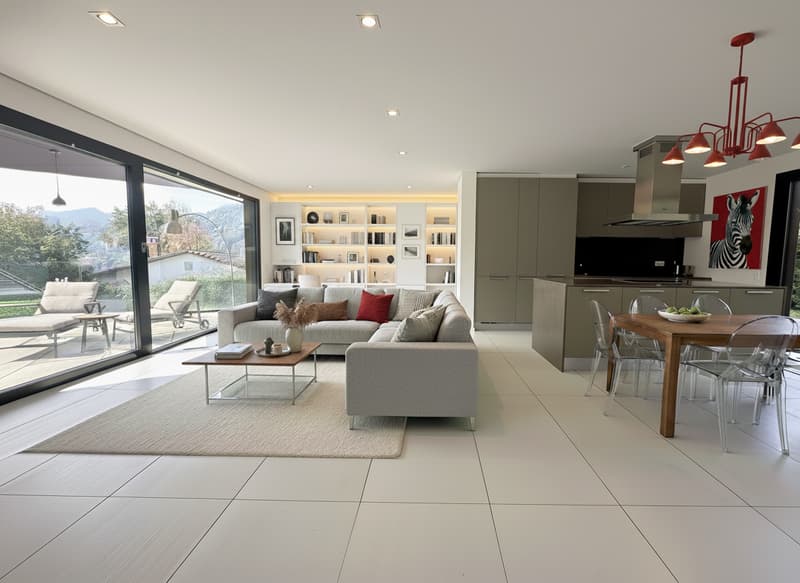open living area with sofa, coffee table, wooden dining table, large windows with terrace, kitchen, shelving unit, chandelier, zebra painting