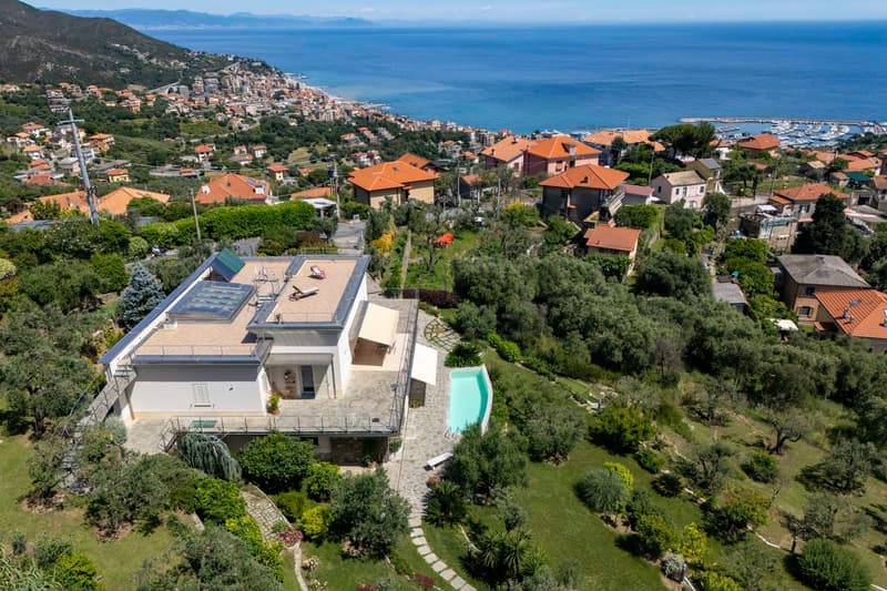 Modern house with swimming pool, solar panels, elevated position, sea view