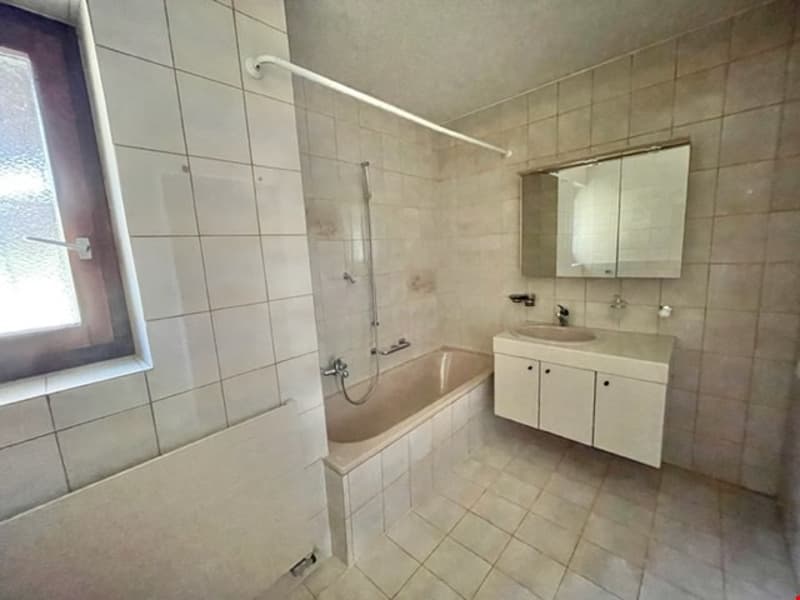 tiled floor, bathtub, sink, mirror, shower area