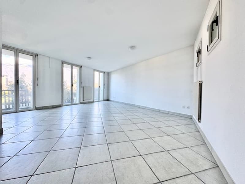 empty room, large sliding windows, balcony, tiled floor