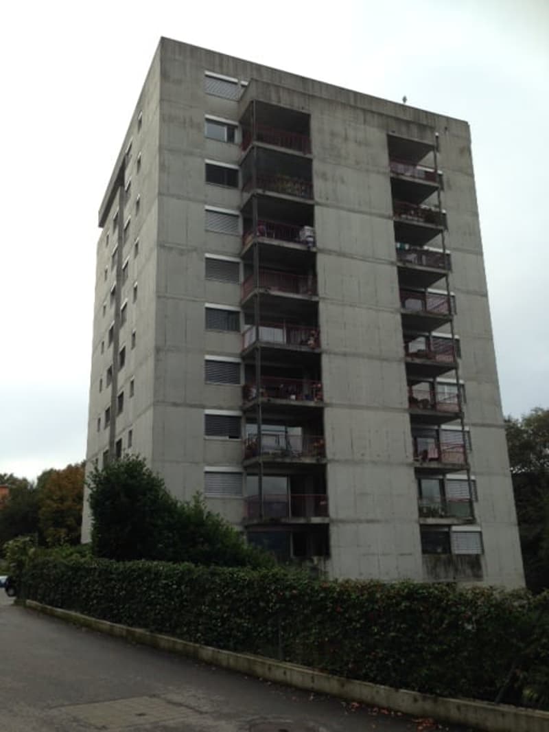 Apartment building with multiple floors and balconies on each floor