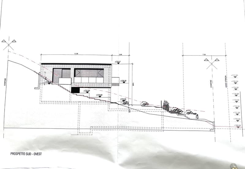 A floor plan of a house with a raised ground floor, multiple windows, and stairs leading to the entrance.