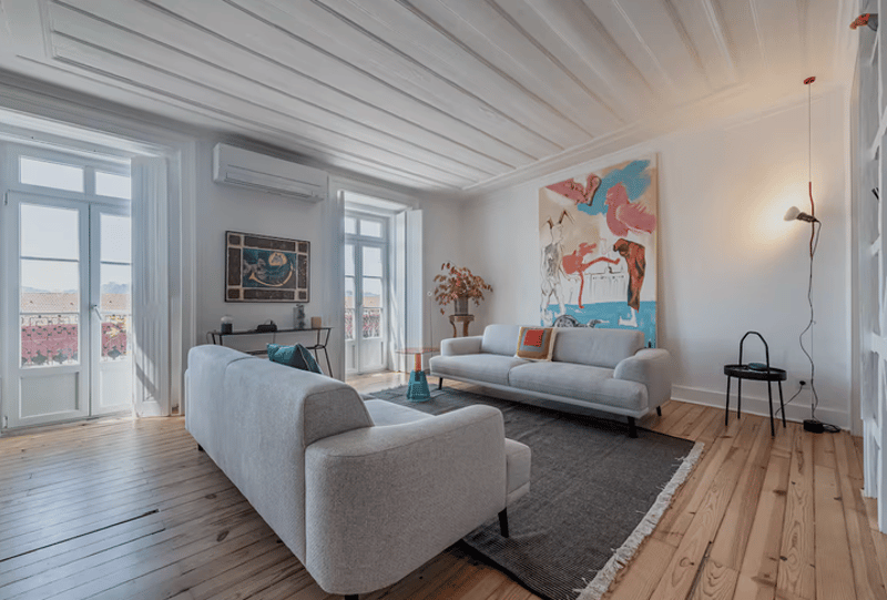 2 sofas, carpet, painting, table, window, door, air conditioner, pendant lamp