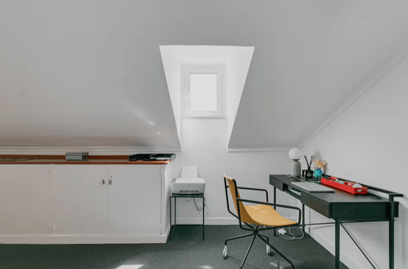 office room with desk, chair, printer, cabinet, skylight