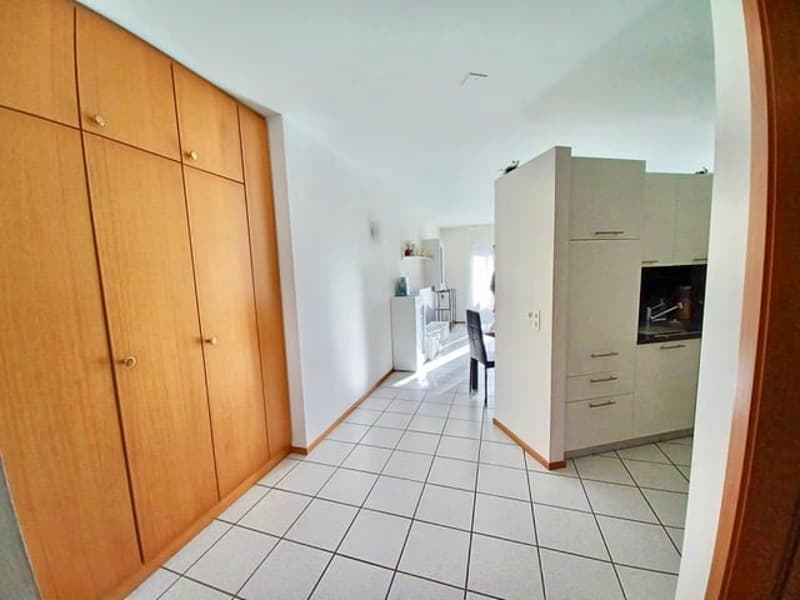 white tiled floor, wooden cupboards, white kitchen, stainless steel appliances