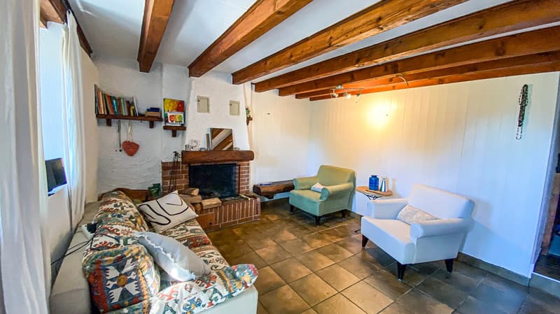 large couch, green armchair, white armchair, fireplace, tiles