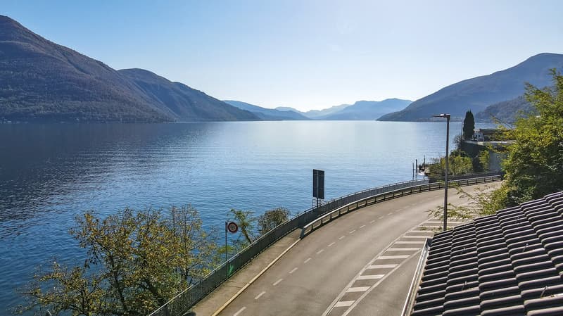 large road overlooking lake