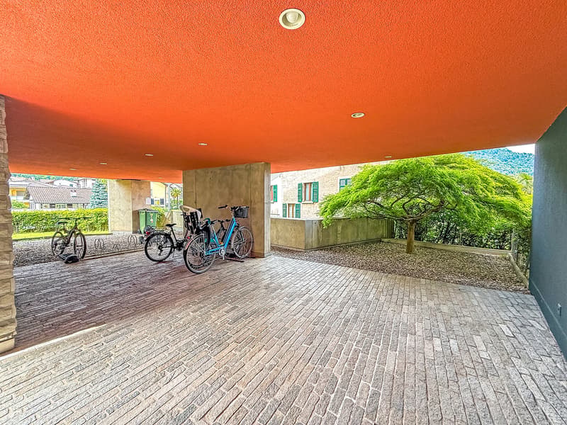 bricked area for bicycle parking, modern design, red ceiling