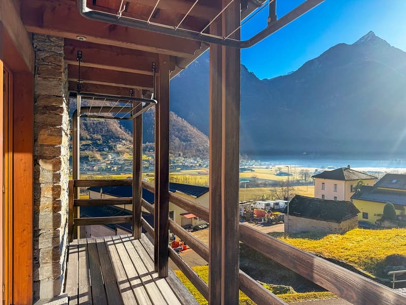 Terrace with wooden railing, beautiful valley and mountain view