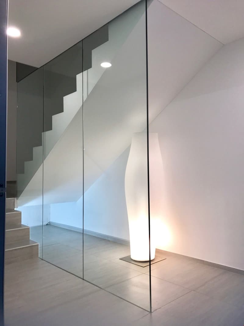 Contemporary design, modern staircase, glass partition, sleek finish, modern lighting