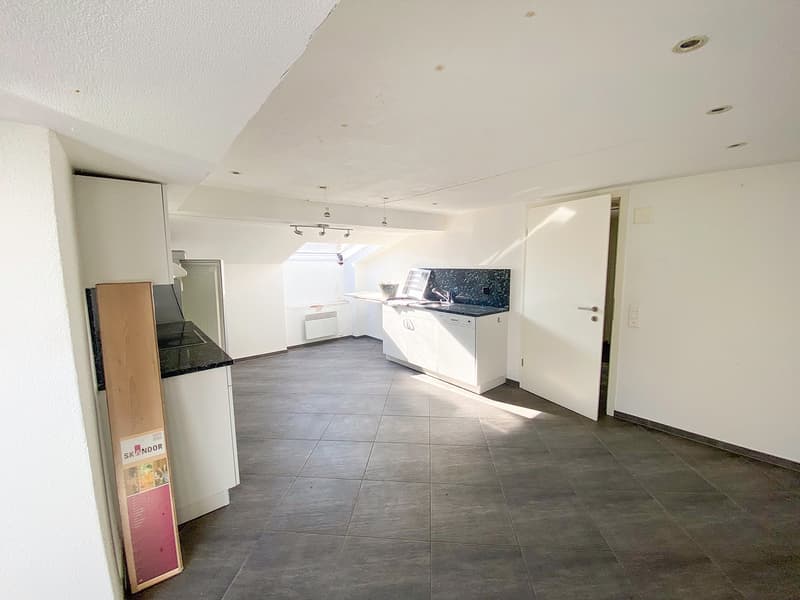 empty kitchen, granite countertop, white cabinets, gas stove, double sink, tiled floor, ceiling lights, white walls