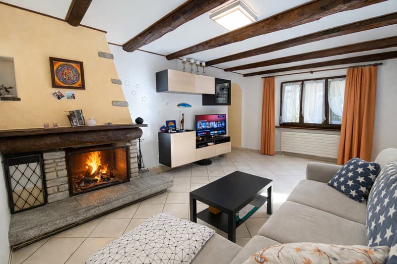 living room, fireplace, flat screen TV, entertainment unit, sofa, coffee table, tiled floor