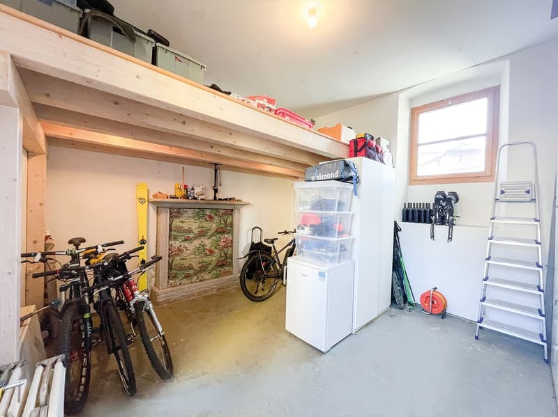 bikes, storage boxes, ladder, refrigerator, bicycles, skis, snowboards, storage boxes, storage boxes on the ceiling