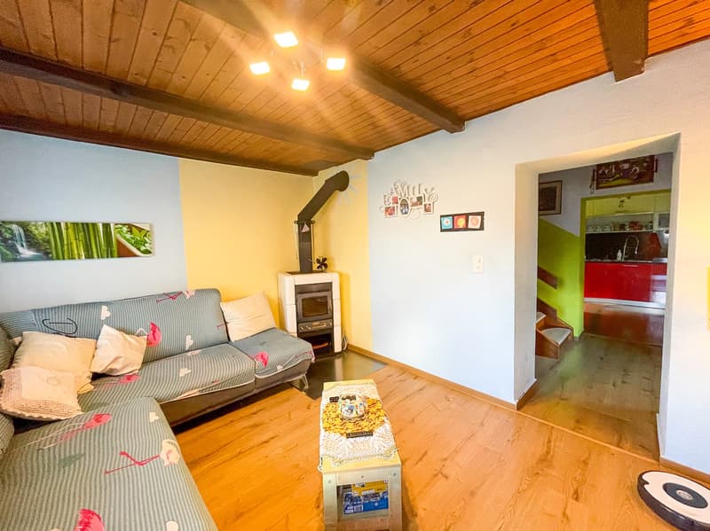 wooden floor, fireplace, sofa, coffee table, lamps