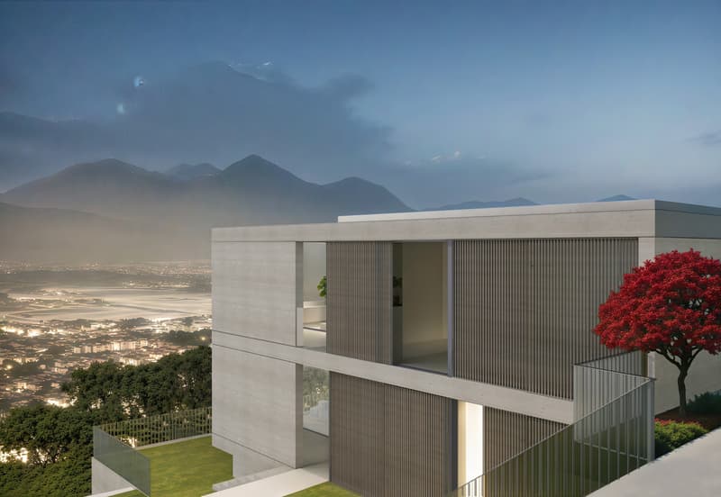 Modern concrete and glass house with balconies, situated on a hillside overlooking a city and mountains in the distance. The house has a minimalist, geometric design with horizontal and vertical lines. There is a red tree in the foreground, adding a pop o