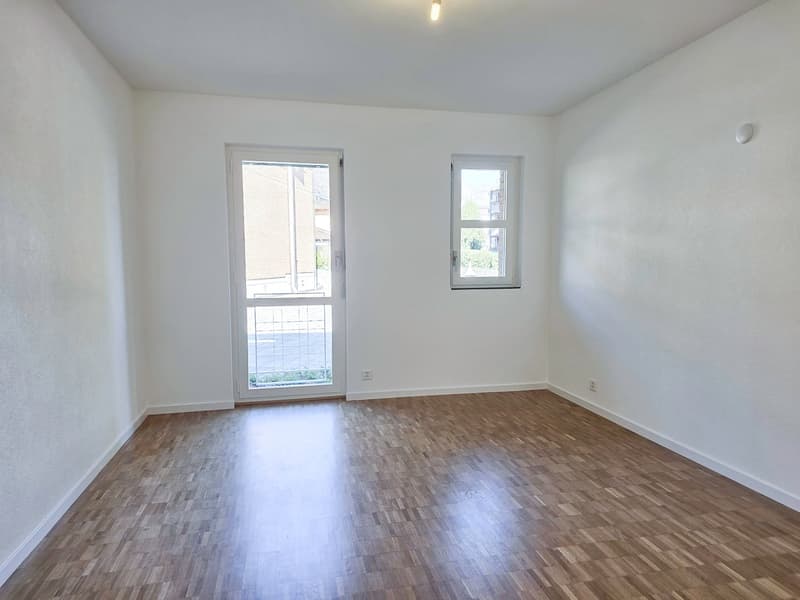 empty room, wooden floor, white walls, glass door, small window, power outlets