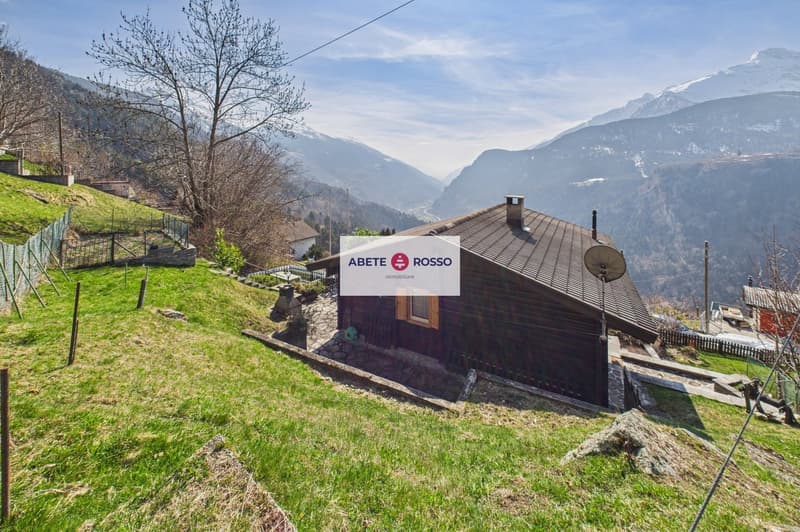 wooden house, brown roof, chimney, satellite dish, surrounded by mountains, green grass, fence