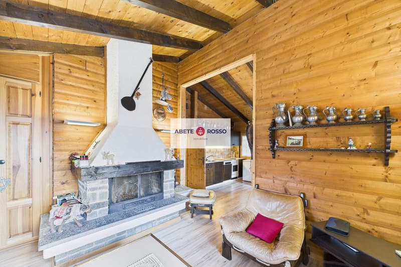 wooden walls, fireplace, wooden floor, leather chair, wooden door, wooden table, wooden cabinet