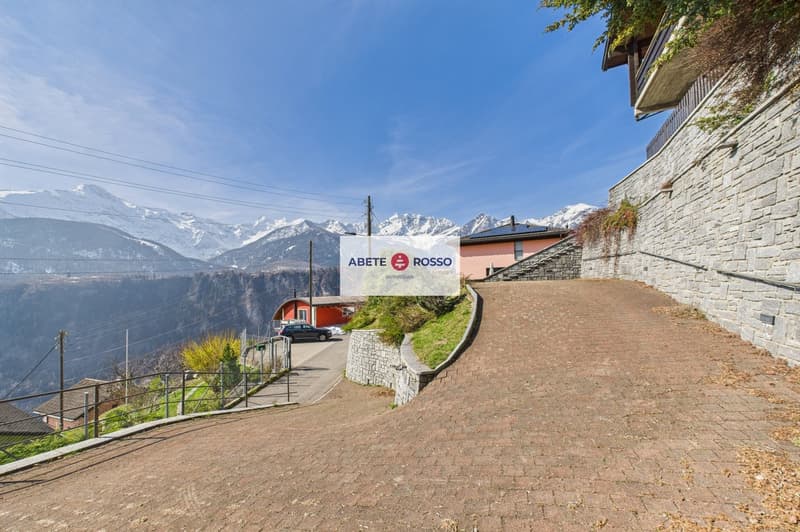 brick road, mountains, house, car, sign