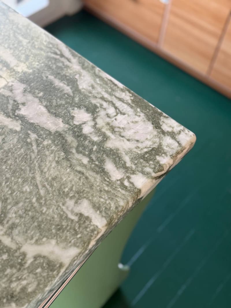 Close-up of marble countertop with green veining.