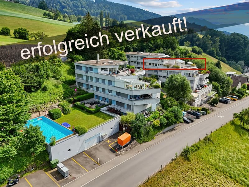 Three-story apartment building, swimming pool, parking spaces, fenced yard, trees