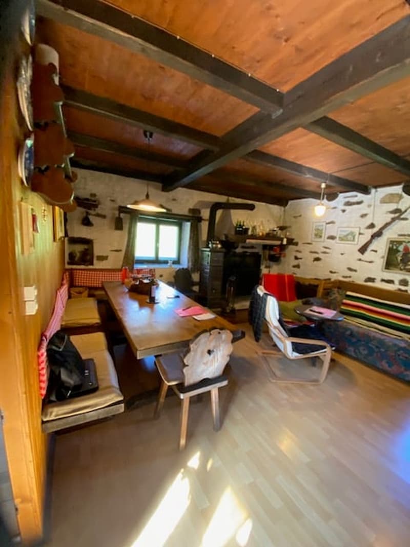 long dining table, wooden benches, fireplace, wooden floor