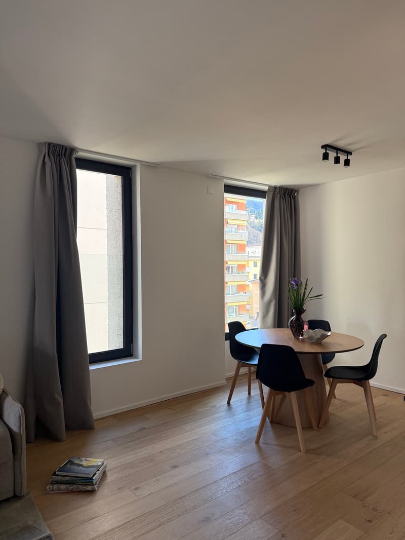 dining table with 4 chairs, floor lamps, grey curtains, parquet floor, view of the outside building