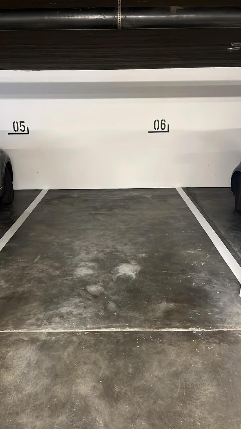 Underground parking area with two parking spaces labeled 05 and 06