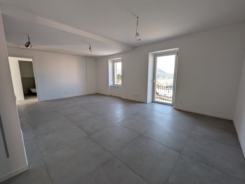 empty room, white walls, gray tiles, two windows, balcony