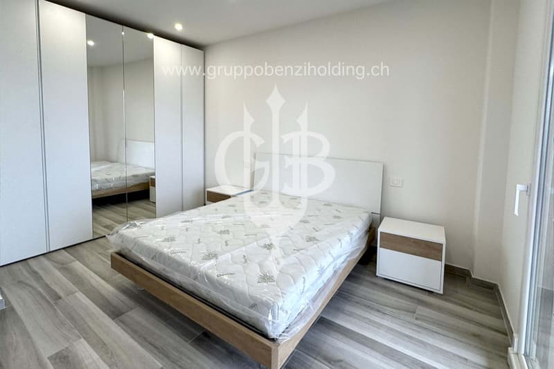 modern design, wooden floor, white walls, large white bed, glass sliding door, large mirror, white nightstands