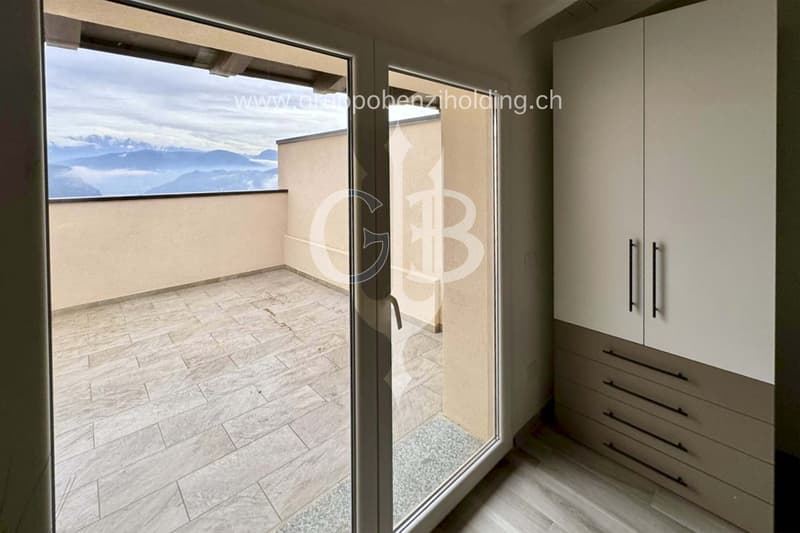 balcony with view, white tiled floor, sliding glass door, white wardrobe with drawers