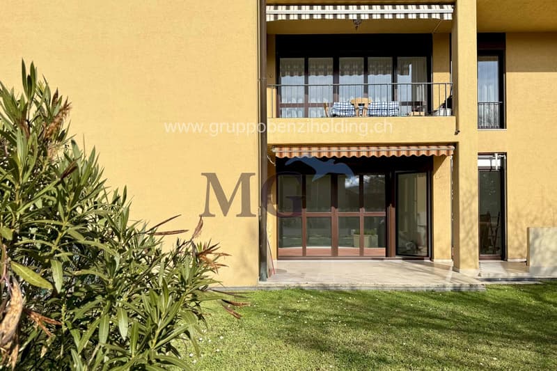 Yellow painted apartment building, balcony, glass door, glass windows, entrance