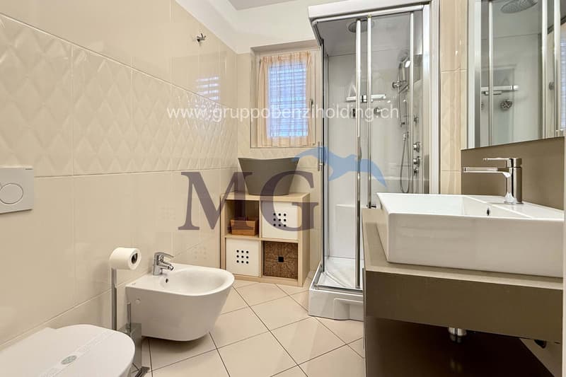 modern design bathroom, glass shower, bidet, toilet, washbasin, shelves, wooden box