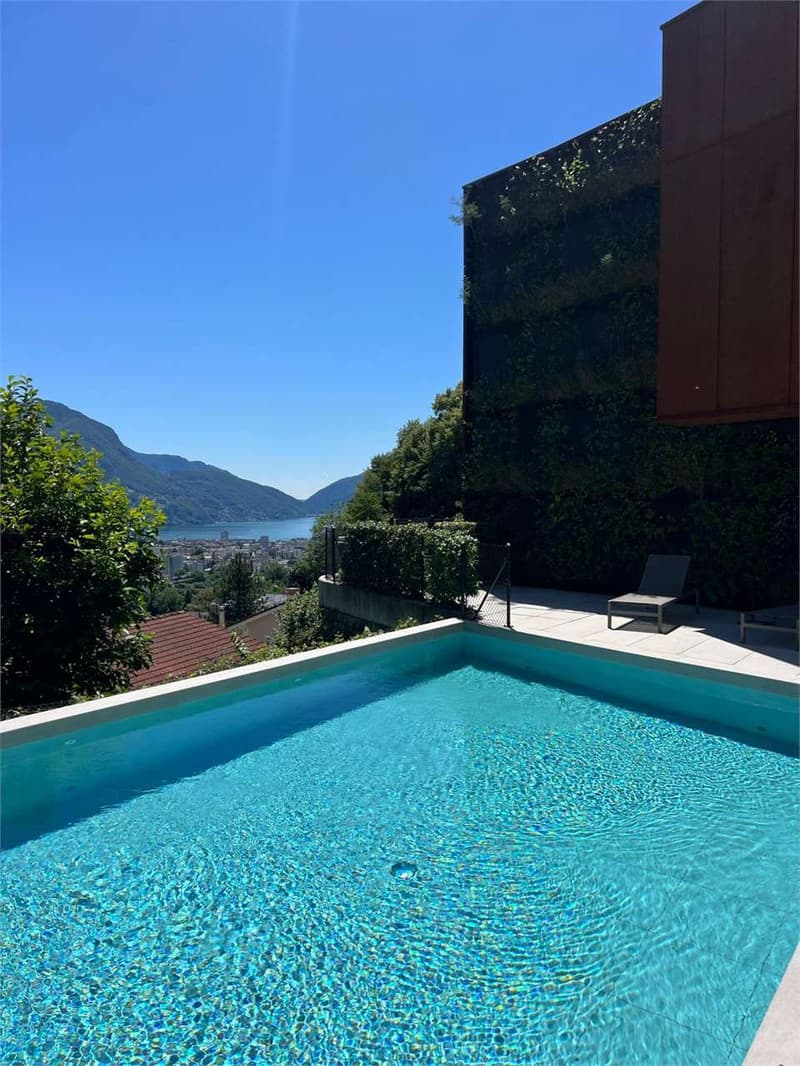Duplex vista lago con giardino e piscina (7)