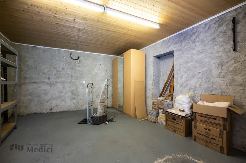 storage room with wooden ceiling, steel trolley, wardrobe, shelves, boxes, various objects