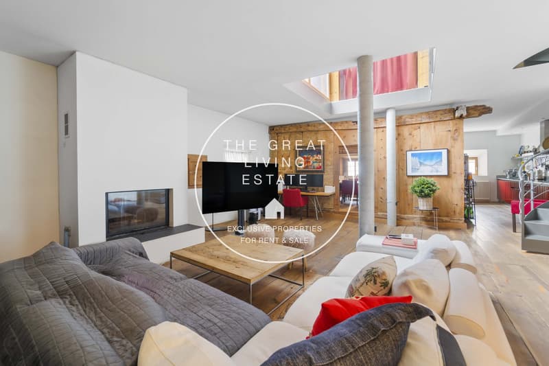 modern living room with white walls, wooden floor, gray couch, white sofa, fireplace, wooden coffee table, large TV, modern art piece, open wooden beams, staircase, spiral staircase, desk with chair, potted plant, radiator, picture frame