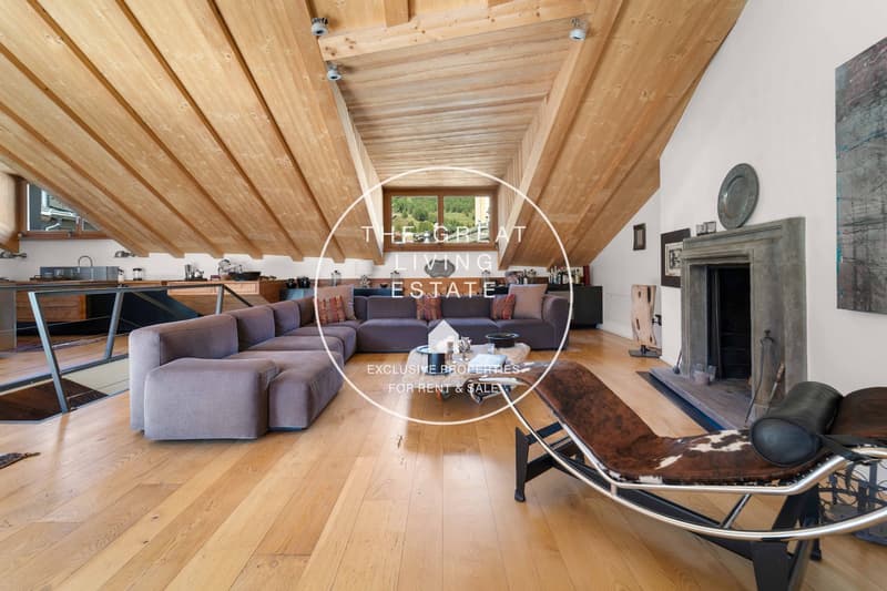 large L-shaped sofa, large glass window, fireplace, wooden floor, wooden ceiling, table